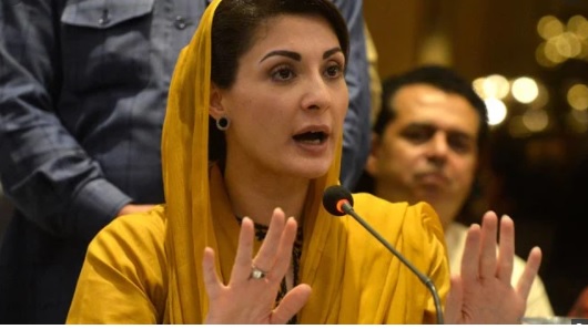Maryam Nawaz in yellow dress talk to media