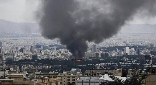 Smoke rises over Tehran skyline after US and Israeli joint military strikes on Iran on February 28, 2026