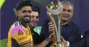 Peshawar Zalmi players celebrate with captain Babar Azam lifting the PSL 11 championship trophy at a packed Gaddafi Stadium in Lahore